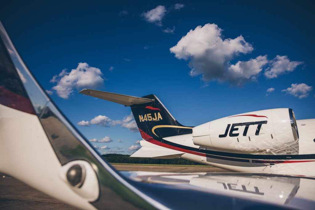 A jet liner sitting on top of an airport runway.