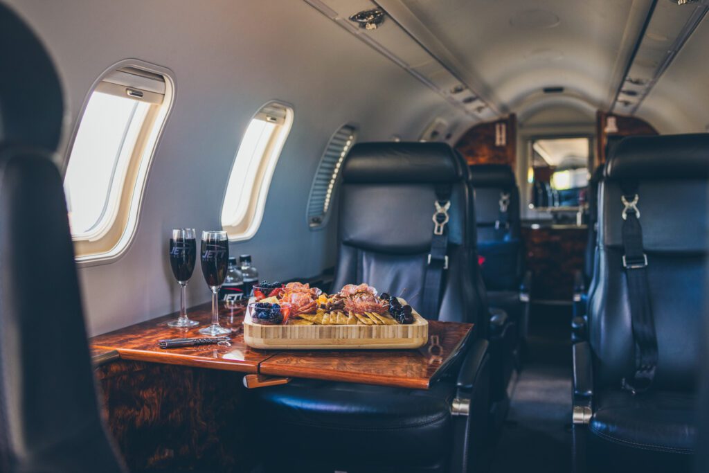 A tray of food on top of an airplane.