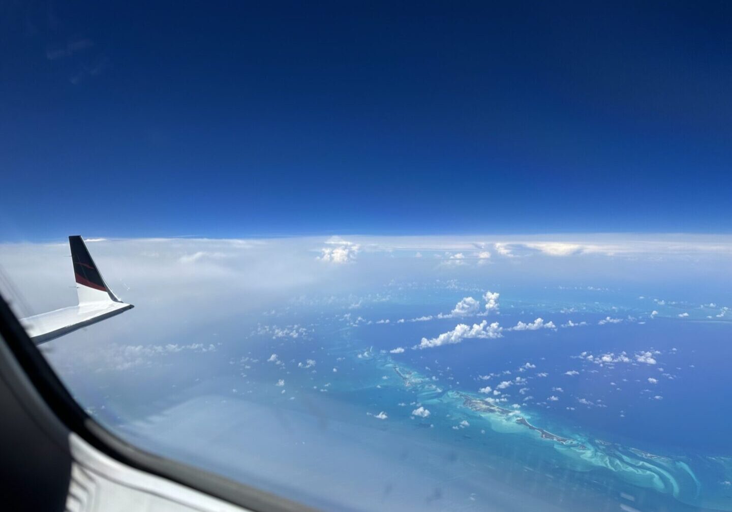 A view of the ocean from an airplane window.